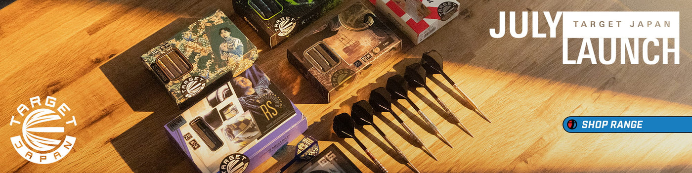 A promotional banner for Target Japan's July Launch featuring various arrow products arranged on a wooden surface, including several arrows in black cases, a purple box, and a set of black arrowheads. The text 'JULY TARGET JAPAN LAUNCH' is displayed on the right, and a 'SHOP RANGE' button is at the bottom right.
